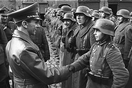 Goebbels congratulates a young recruit - Photo Credit: rarehistoricalphotos.com