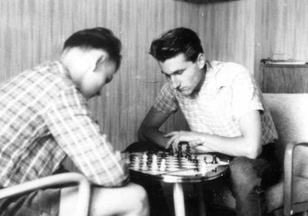 Peter with Spiked Haircut Playing Chess with a Friend